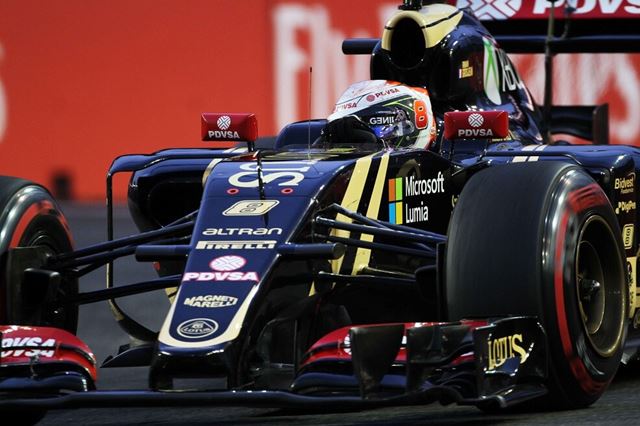 Photo of a black F1 car in motion